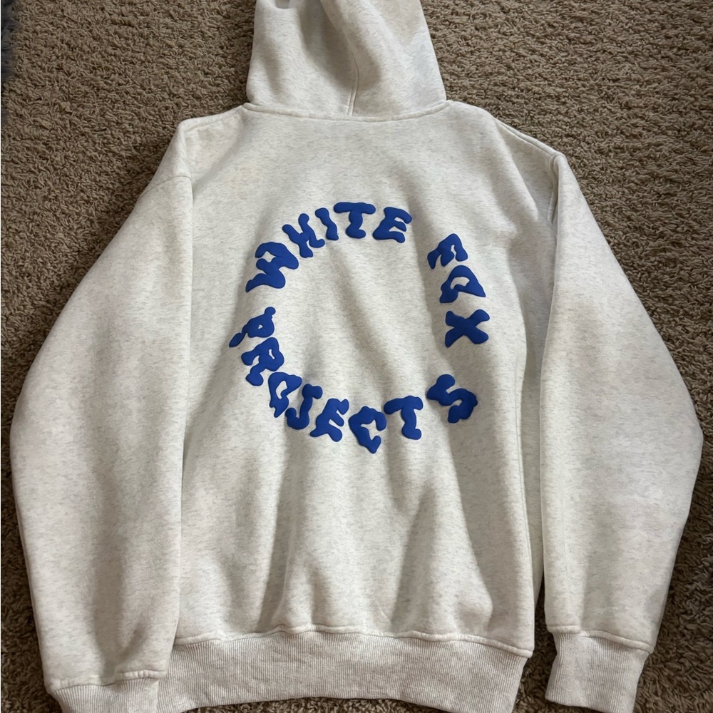 White Fox Boutique Cream Hoodie with Blue Graphic